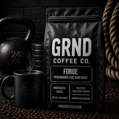 GRND FORGE dark roast coffee bag with steaming mug in a strength gym