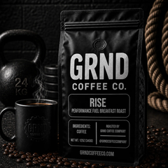 GRND RISE breakfast roast coffee bag with steaming mug in a dark gym